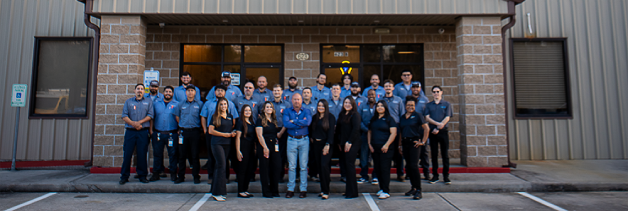 Group photo of smiling Mr. Electric team members.