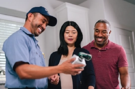 Mr electric technician showing a product to client.