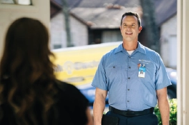 Mr. electric technician talking to a customer.