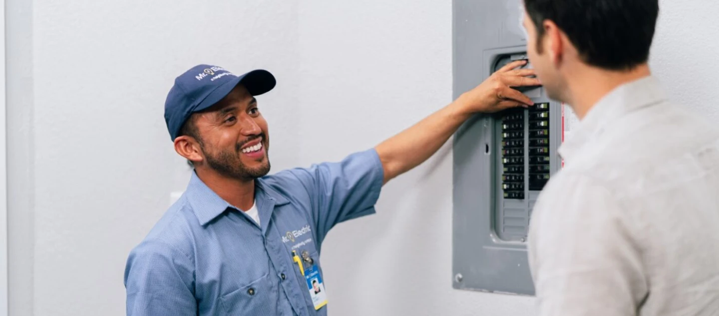 Mr. Electric electrician explaining circuit installation to a customer in Gastonia, NC.