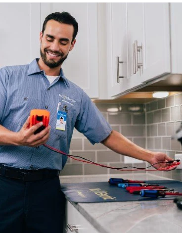 Mr. Electric electrician testing an electricity outlet in Gastonia, NC.