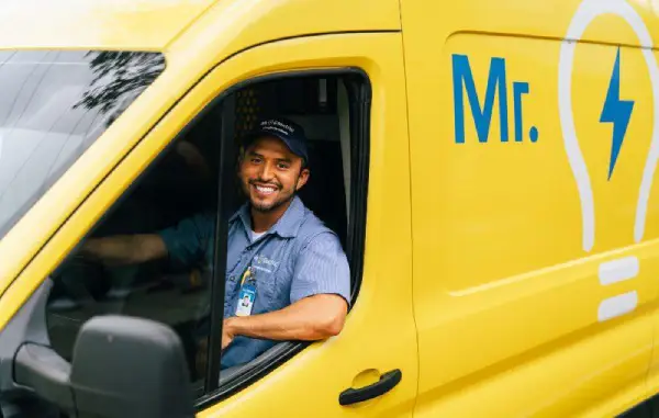 Mr. Electric commercial electrician driving his work van to a service appointment