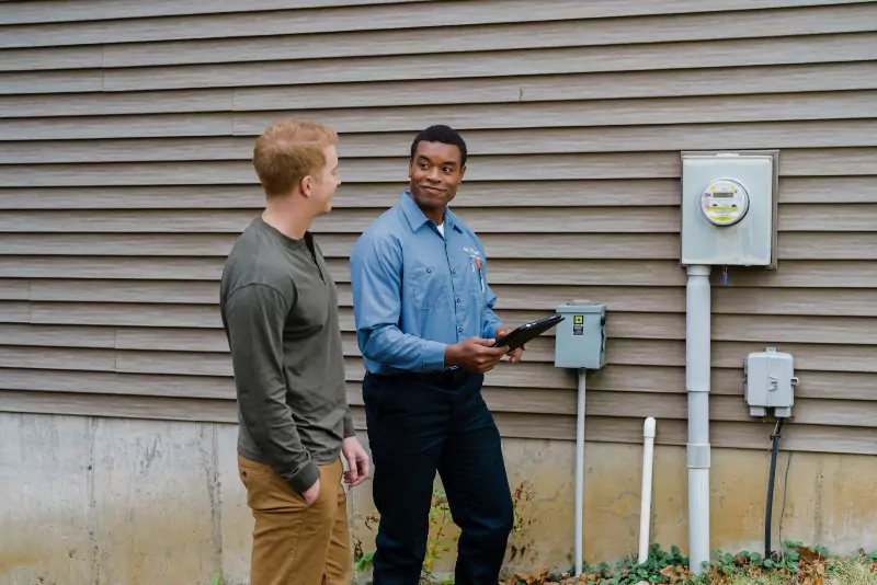 Mr. Electric of Wichita electrician and customer discussing commercial generator options.