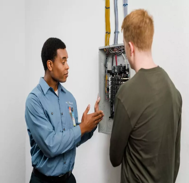 Mr. Electric of Wichita electrician explains commercial panel upgrading to customer.