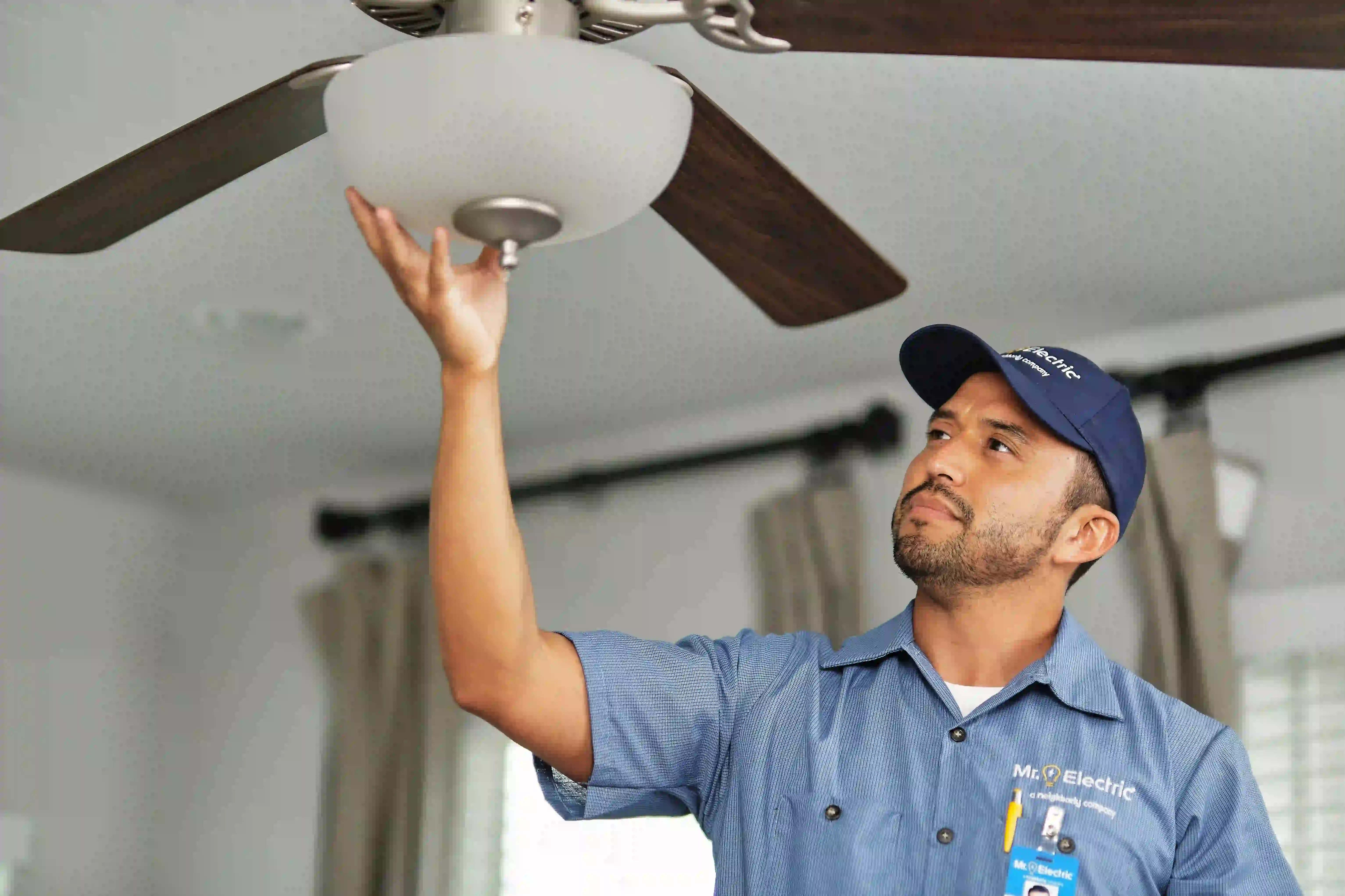 Mr. Electric electrician with ceiling fan.